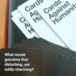 CARDS AGAINST HUMANITY Card Game + 1st Expansion Deck & Travel Case